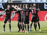 Real Madrid's Karim Benzema celebrates scoring their second goal with teammates on March 20, 2021
