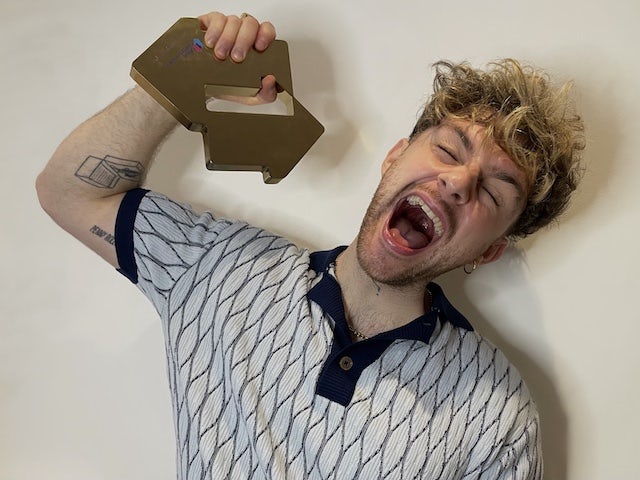 Tom Grennan celebrates his number one album on March 19, 2021