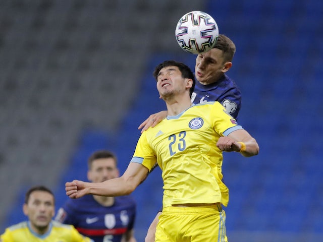 France's Lucas Digne in action with Kazakhstan's Marat Bystrov on March 28, 2021