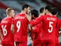 Azerbaijan's Ramil Sheydaev celebrates scoring their first goal with teammates on March 27, 2021