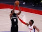 Brooklyn Nets guard James Harden shoots over Detroit Pistons guard Hamidou Diallo on March 27, 2021