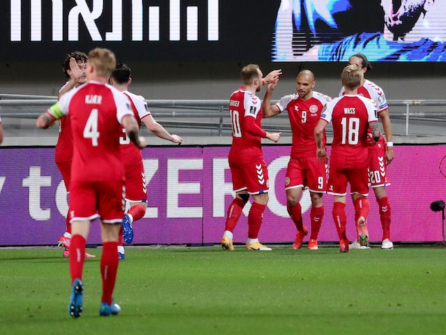 Denmark's Martin Braithwaite celebrates scoring their first goal with teammates on March 25, 2021