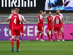 Denmark's Martin Braithwaite celebrates scoring their first goal with teammates on March 25, 2021