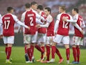 Denmark's Mathias Jensen celebrates scoring their fifth goal with teammates on March 28, 2021