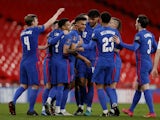 England's Ollie Watkins celebrates scoring their fifth goal with teammates on March 25, 2021