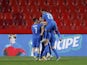 Greece's Anastasios Bakasetas celebrates scoring their first goal with teammates on March 25, 2021