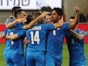 Israel's Dor Peretz celebrates scoring their first goal with teammates on March 28, 2021