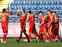 Montenegro's Zarko Tomasevic celebrates scoring their third goal with teammates on March 27, 2021