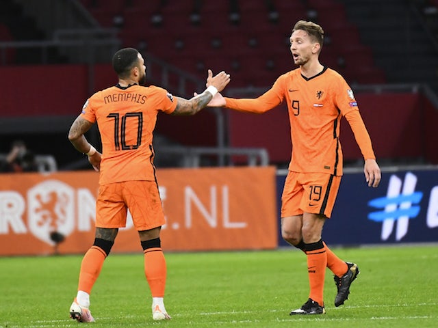 Netherlands' Luuk de Jong celebrates scoring their second goal with Memphis Depay on March 27, 2021