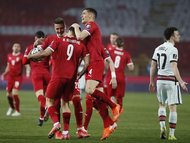 Serbia's Aleksandar Mitrovic celebrates scoring their first goal with teammates on March 27, 2021