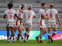 St Helens' Jonny Lomax celebrates scoring their first try with teammates against Salford on March 26, 2021