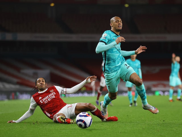 Arsenal's Pierre-Emerick Aubameyang in action with Liverpool's Fabinho in the Premier League on April 3, 2021