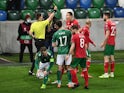 Bulgaria's Valentin Antov is shown a yellow card during the clash with Northern Ireland on March 31, 2021