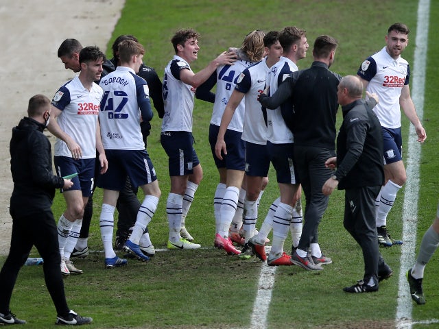 Preston North End's Brad Potts celebrates with teammates after scoring against Norwich City in the Championship on April 2, 2021