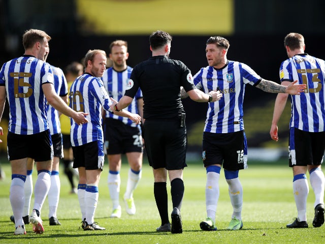 Sheffield Wednesday's Josh Windass remonstrates with referee Chris Kavanagh after Tom Lees scored an own goal against Watford in the Championship on April 2, 2021