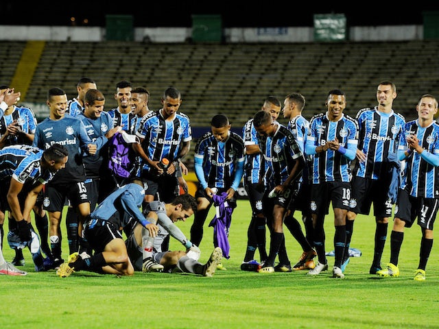 Gremio players celebrate after the match on March 17, 2021