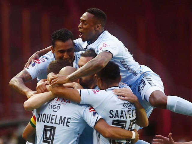 Bolivar's Marcos Riquelme celebrates scoring their first goal with teammates on December 2, 2020