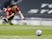 Manchester United's Edinson Cavani scores against Tottenham Hotspur in the Premier League on April 11, 2021