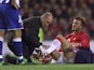 Manchester United's David Beckham receives treatment after an injury in 2002