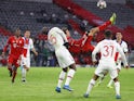 Bayern Munich's Thomas Muller shoots at goal with an overhead kick against Paris Saint-Germain on April 7, 2021