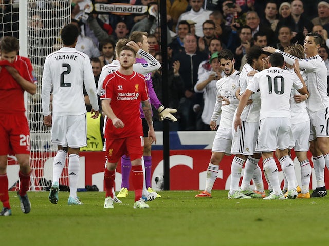 Real Madrid's players celebrate a goal against Liverpool during their Champions League Group B soccer match at Santiago Bernabeu stadium in Madrid November 4, 2014