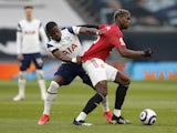 Manchester United's Paul Pogba in action with Tottenham Hotspur's Serge Aurier in the Premier League on April 11, 2021