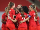 Canada's Nichelle Prince celebrates scoring their second goal against England on April 13, 2021