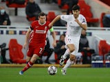 Real Madrid's Marco Asensio in action with Liverpool's James Milner in the Champions League on April 14, 2021