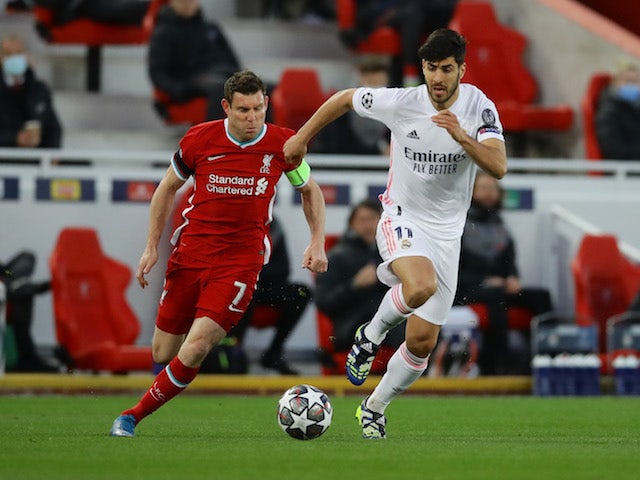 Real Madrid's Marco Asensio in action with Liverpool's James Milner in the Champions League on April 14, 2021