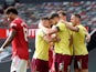 James Tarkowski celebrates scoring Burnley's first goal with teammates against Manchester United in the Premier League on April 18, 2021