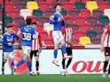 Cardiff City's Kieffer Moore celebrates scoring their first goal from the penalty spot against Brentford in the Championship on April 20, 2021