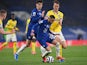 Chelsea's Hakim Ziyech and Kai Havertz in action with Brighton & Hove Albion's Dan Burn in the Premier League on April 20, 2021