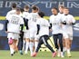 Leeds United players during the warm up before the match wearing UEFA Champions League T- Shirts with messages saying Football is for the Fans and Earn It