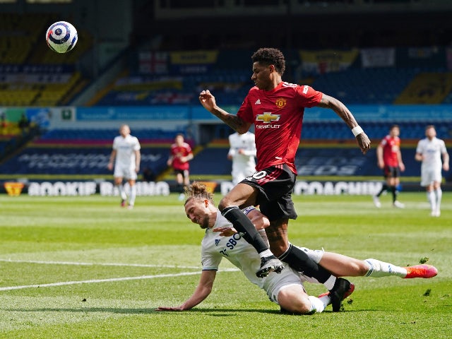 Manchester United's Marcus Rashford in action with Leeds United's Luke Ayling in the Premier League on April 25, 2021