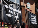 Anti Super League banners and Liverpool fans are seen outside Anfield as twelve of Europe's top football clubs launch a breakaway Super League