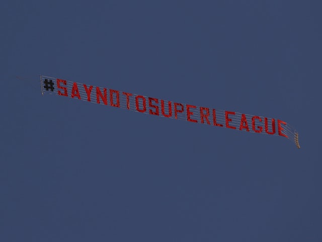 A message of #SayNoToSuperLeague flies over the stadium before the match as fans protest the planned European Super League