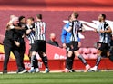 Newcastle United's Joe Willock celebrates scoring their first goal against Liverpool in the Premier League on April 24, 2021