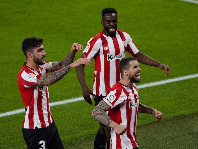 Athletic Bilbao's Inigo Martinez celebrates scoring his second goal with his teammates on April 25, 2021