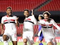 Sao Paulo's Reinaldo celebrates scoring their second goal with teammates on April 30, 2021
