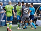 Seattle Sounders FC defender Nouhou (5) and Minnesota United FC midfielder Emanuel Reynoso (10) have words during the first half at Lumen Field on April 17, 2021