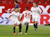 Sevilla's Marcos Acuna celebrates scoring their first goal with teammates on April 4, 2021