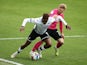 Swansea City's Jamal Lowe in action with Derby County's Kamil Jozwiak in the Championship on May 1, 2021