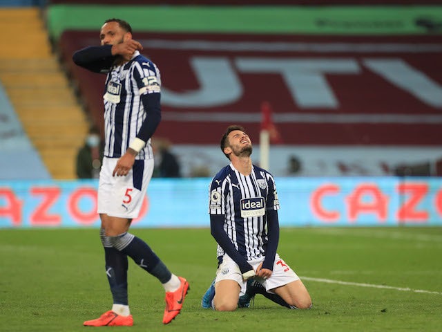 West Bromwich Albion's Okay Yokuslu and Kyle Bartley looks dejected after Aston Villa's second goal on April 25, 2021