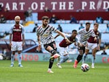 Manchester United's Bruno Fernandes scores their first goal from the penalty spot against Aston Villa in the Premier League on May 9, 2021