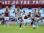Manchester United's Bruno Fernandes scores their first goal from the penalty spot against Aston Villa in the Premier League on May 9, 2021
