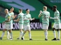 Celtic's Callum McGregor with teammates before the match in March 2021