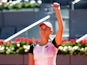 Elise Mertens celebrates beating Simona Halep at the Madrid Open on May 4, 2021