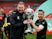 Harrogate Town's Josh Falkingham and manager Simon Weaver celebrate with the trophy after winning the FA Trophy Final on May 3, 2021