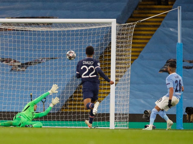 Manchester City's Riyad Mahrez scores their second goal against Paris Saint-Germain in the Champions League on May 4, 2021