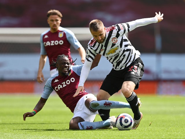 Manchester United's Luke Shaw in action with Aston Villa's Bertrand Traore in the Premier League on May 9, 2021